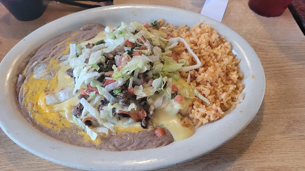 One Sour Cream Chicken Enchiladas and One Cheese Enchilada